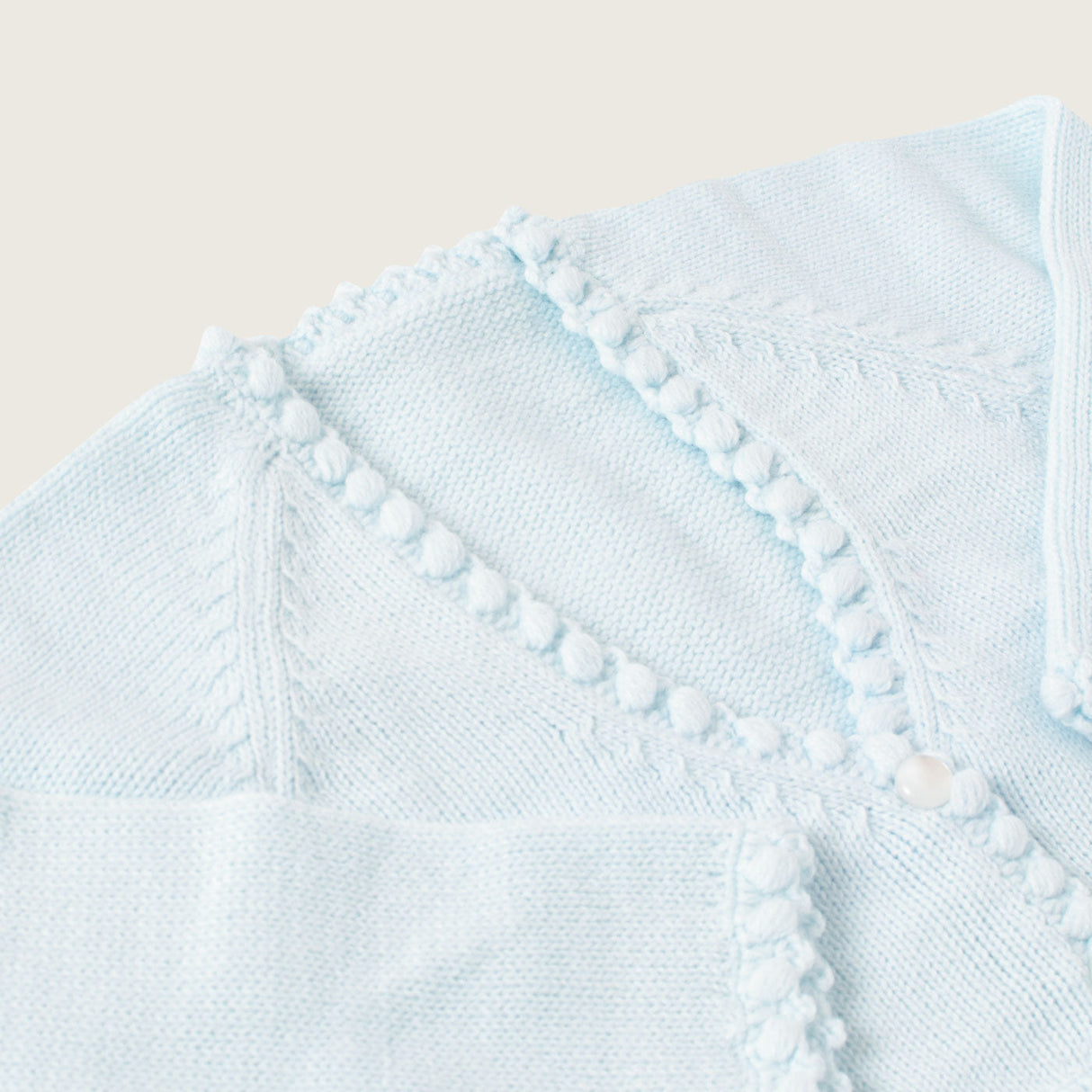 Bolero celeste pompones